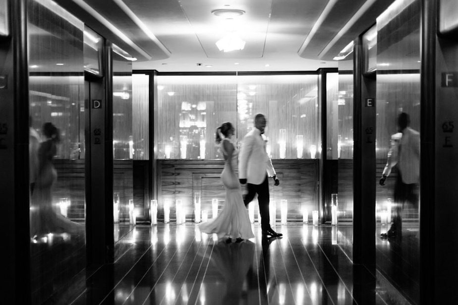 Bride and groom walking in the hallway at their rainbow room wedding in nyc