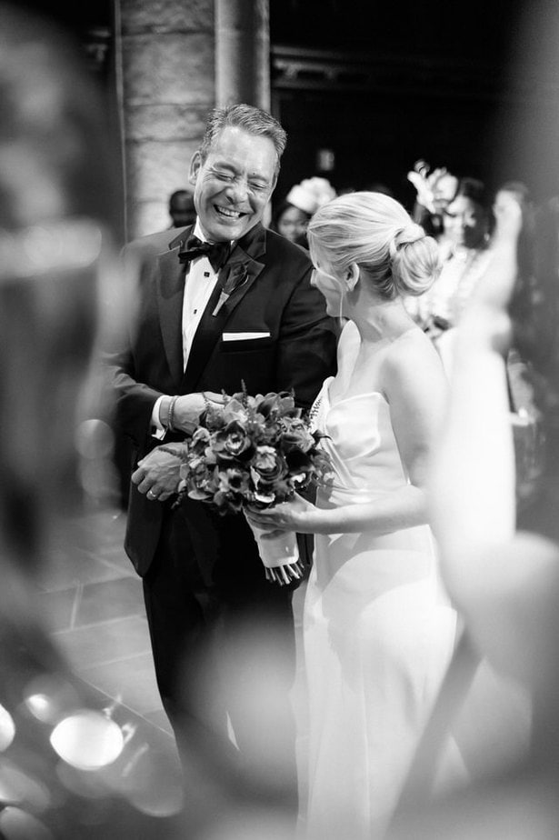 bride and her father walking down the aisle in a church wedding in nyc