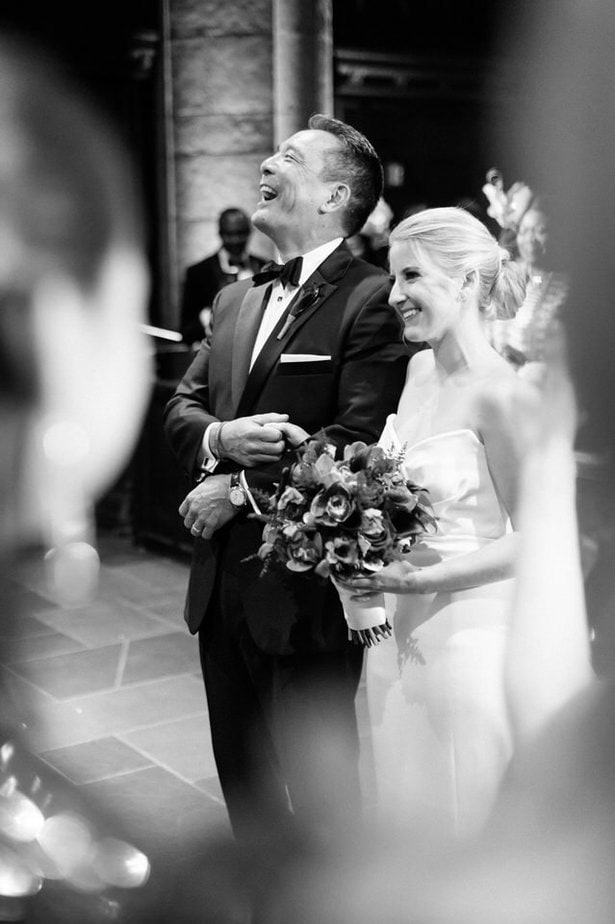 bride and her father walking down the aisle in a church wedding in nyc