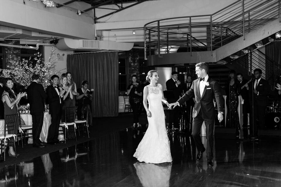 bride and groom making grand entrance during their wedding at tribeca rooftop