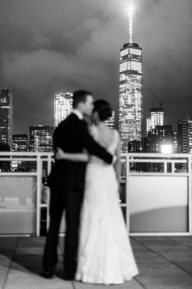 bride and groom portraits at night in tribeca rooftop