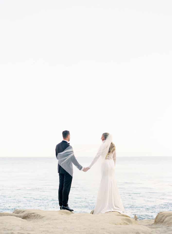 bride and groom wedding portraits by the ocean in Los Angles